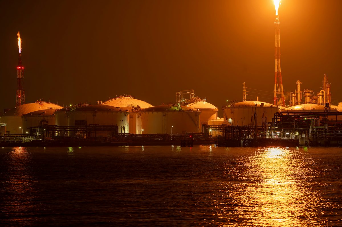 Industrial refinery and energy infrastructure facility at dusk